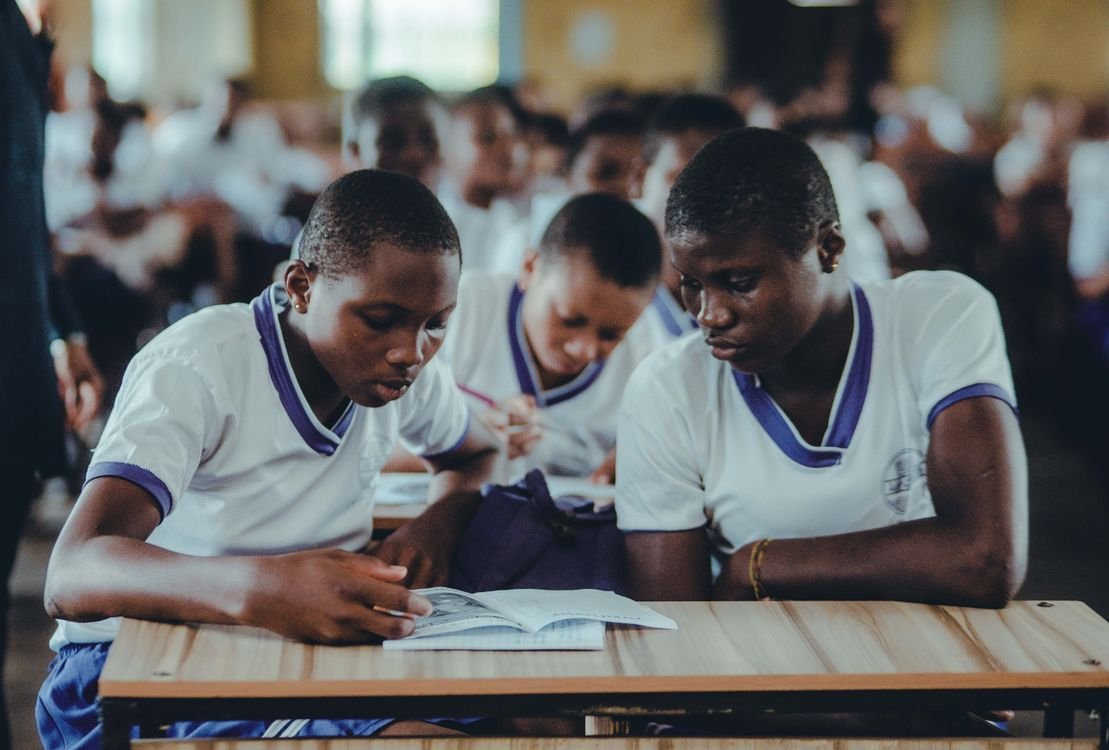 African students studying together in a classroom — stock photograph